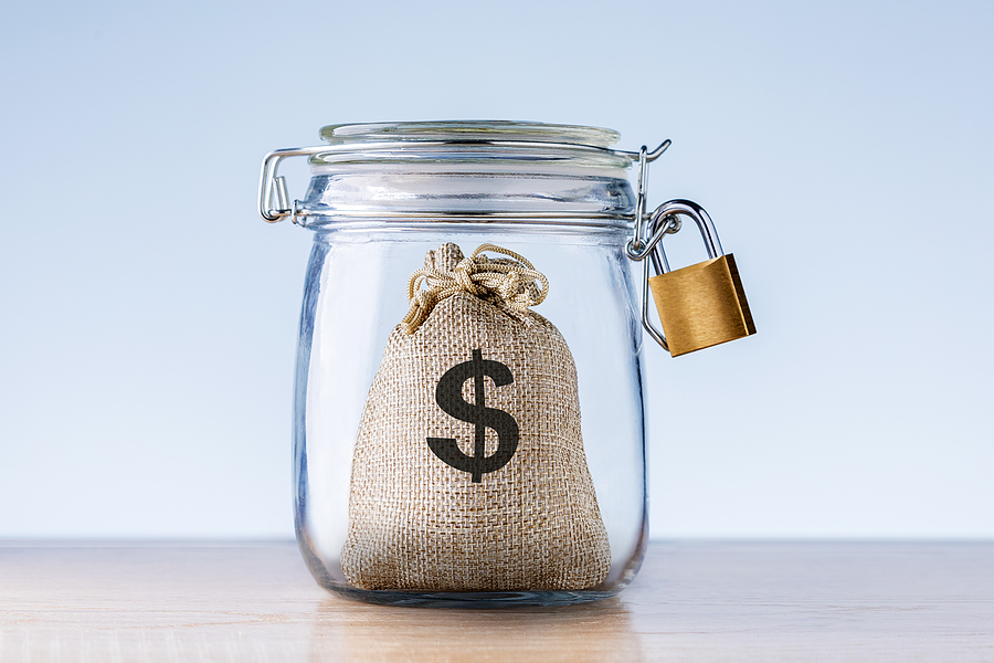 Money For Emergency Fund In The Glass Jar. Concept Financial Sec
